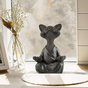 Detailed shot of a cute zen meditating black cat resin figurine, ideal for desktop and home decor.