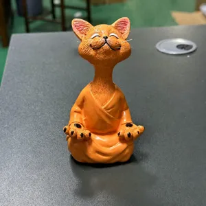 Resin meditating cat figurine, cute cartoon lucky desktop ornament for home decor.