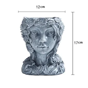Resin goddess head flower pot with daisy garland detail, vintage grey finish, 12x17cm.