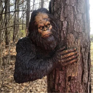 Bigfoot tree hugger garden statue, realistic resin gorilla yard art for outdoor decor.