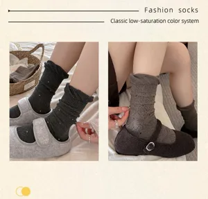 Close-up of Japanese style polka dot slouch socks, bubble cuff mid-tube design, cozy aesthetic.