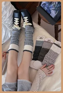 Korean style knit leg warmer detail showing cozy wool texture, ribbed pattern and lace trim.