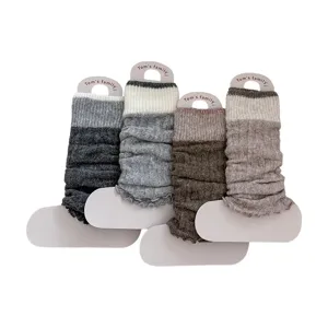 Chic colorblock knit leg warmers for women, cozy winter ruffle slouch socks with warm wool.