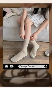 Detailed close-up view of the Korean style solid color mesh mid-tube socks with rolled edge.