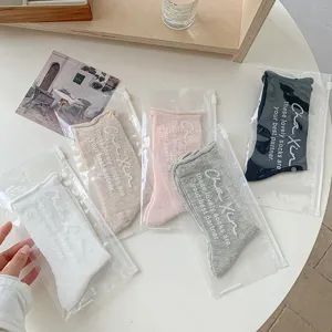 Japanese cute solid color mid-calf socks with zipper bags, soft, breathable, casual spring wear.
