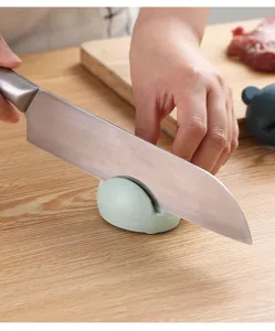 Compact mini kitchen knife sharpener in action, cartoon design for quick and safe sharpening.