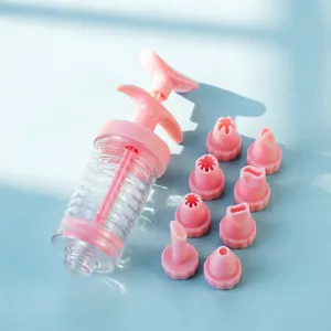 Plastic piping syringe set with 8 interchangeable nozzles for cake and cookie decorating tools.