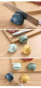 Compact portable mini cute cartoon knife sharpener for fast and easy home kitchen use.