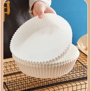 Disposable air fryer paper liners, non-stick parchment baking paper for roasting and cooking.