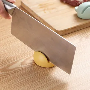 Portable cartoon mini knife sharpener for home kitchen use, quick and safe sharpening tool.