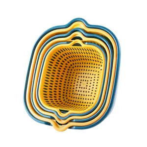 Plastic nesting colander set with dual color drain baskets for kitchen fruit and vegetable washing.