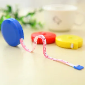 Portable mini retractable tape measure cute circular cloth ruler for body measurements and sewing.