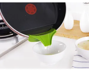 Silicone soup pour spout detail showing anti-spill liquid diversion on pot edge for kitchen.