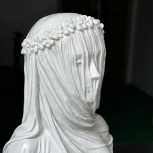 White resin veiled woman bust sculpture detail shot, classic artistic home decor ornament.