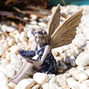 Resin fairy figurine detail view with textured wings, perfect for garden and home desktop decor.