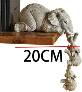 Elephant figurine detail view showing miniature landscape design and cute animal sculpture style.