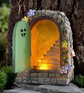 Solar fairy garden door ornament with glowing stairs and flowers, perfect for outdoor yard decor.