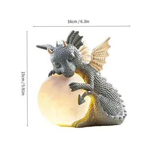 Detailed close-up of a cute glowing resin dragon moon ornament, showing exquisite texture.