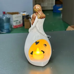 Resin mother and daughter hugging figurine with LED candle holder, warm home decor gift.