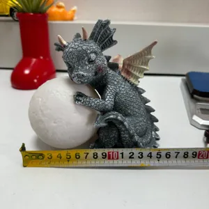 Cute resin sleeping baby dragon holding glowing moon figurine for desk home decoration