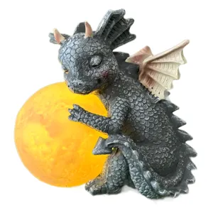 Resin glowing moon dragon figurine cute little dinosaur decorative ornament for home desktop decor.
