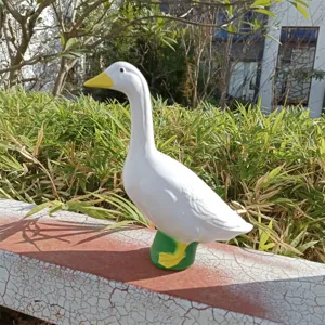 Resin white goose statue garden ornament detail, large decorative animal sculpture for pond or yard.