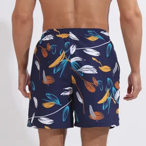 Pantaloncini da mare uomo con stampa di foglie tropicali, asciugatura rapida estate.