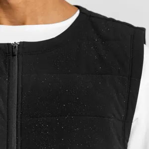 Men's black quilted zip-up vest detail shot, waterproof winter puffer gilet outerwear.