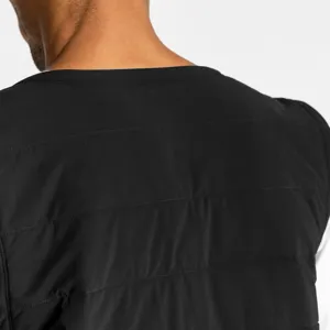 Men's black winter padded vest detail view, featuring warm quilted design and sleeveless cut.