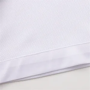 Close-up detail of white breathable mesh athletic fabric with clean stitching and texture.