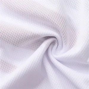 Detailed close-up texture of white breathable mesh quick-dry fabric for sports apparel.