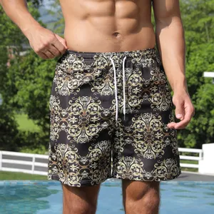 Detailed view of men's quick dry beach shorts with luxury baroque print, casual wear.