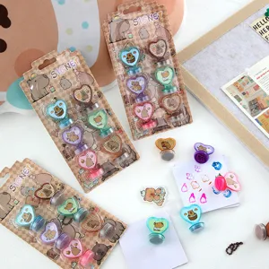 Cute cartoon capybara heart stamp set detail view, colorful ink pads and fun stationery items.