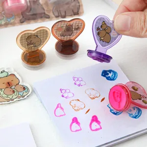 Cute capybara heart shaped stamp set detail view, colorful ink stamping stationery for journaling.