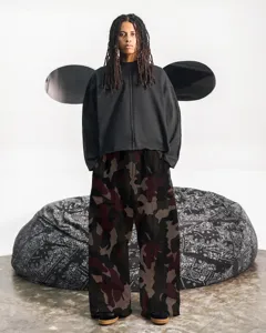 Detailed view of loose camo cargo pants with streetwear style, comfortable fit for daily wear.
