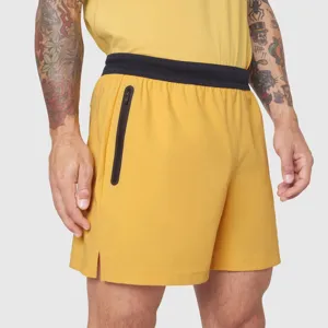 Men's yellow athletic sports shorts with zipper pocket and black waistband for gym and casual wear.