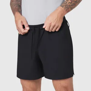 Detailed view of men's black athletic quick-dry shorts featuring an elastic drawstring waist.