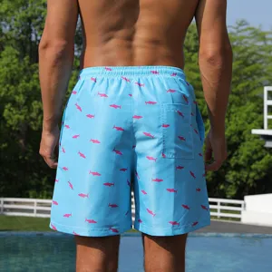 Men's quick-dry swim trunks with cute pink shark pattern, loose fit beach shorts for summer.