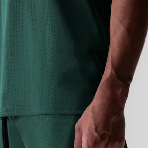 Close up detail of mens quick drying mesh athletic vest showing breathable fabric texture.