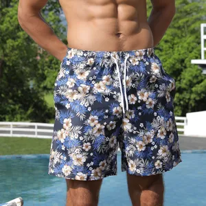 Men's tropical floral print quick-dry beach shorts detail showing elastic waistband and drawstring.