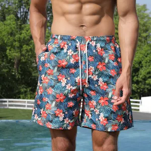 Men's tropical floral board shorts detail view, featuring quick-dry fabric and adjustable drawstring