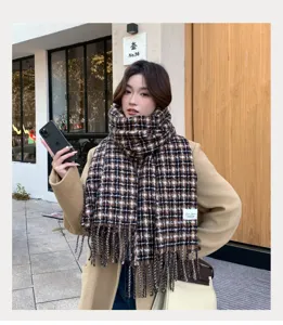Brown plaid tassel scarf for women, cozy winter warm fashion winter accessory detail shot.