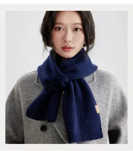 Dark blue winter knit scarf for women, cozy thermal neck warmer for cold weather.
