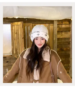 Korean winter warm knitted beanie for women, fuzzy plush hat with stylish cross embroidery.