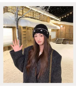 Korean style winter warm knitted beanie with chic white cross embroidery design for women.