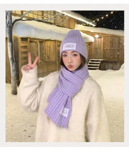 Cozy winter purple knitted hat and scarf set detail, elegant lace patch, snow scene style.