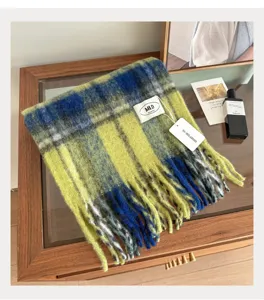 Detailed shot of cozy winter plaid scarf with fringe, stylish British retro design for all.
