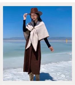 Ethnic style thick warm winter shawl cape for women, outdoor photo shoot fashion outerwear.