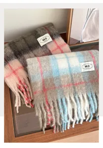 Detail shot of cozy plaid scarf with fringe, soft texture and vintage winter style detail.