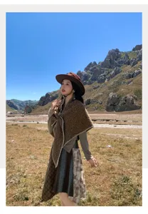 Detailed shot of the ethnic style winter warm cape shawl, outdoor view and textured fabric.